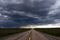 Straight Highway and Storm Cloud