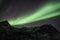 Straight lines of northern Lights beams in Tromso