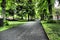 Straight path shaded by trees in the famous public gardens of Halifax on a summer day