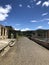 A straight pathway flanked with sandstone ruins from the convict period Port Arthur Tasmania.