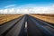 Straight Road in the Countryside of Iceland and Blue Sky