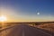 straight road through the nullarbor dessert of Australia at sunset, South Australia, Australia