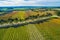 Straight rows of vines and scenic countryside.