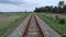 straight train tracks. horizontal iron. transportation. railroad gravel. view of the railroad. straight object.