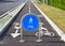 Straight two way cycle lane with traffic street signs.