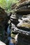 Straight view from height to the canyon whose rocks resemble an accordion and water