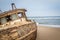 Stranded boat at the coast of the Namibian Desert.