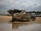 Stranded broken wooden shipwrecks on fishing boat naval graveyard marine cemetery in Magouer Etel river Brittany France