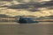 Stranded iceberg and ice near evening in arctic landscape, near Pond Inlet, Nunavut