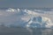 Stranded icebergs in the fog at the mouth of the Icefjord near Ilulissat. Nature and landscapes of Greenland.