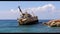 Stranded ship in Cyprus. footage of a beautiful shipwreck near Paphos.Aerial footage of Mediterranean sea on the sunset. Stormy se
