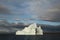 Stranded tabular iceberg and ice near evening in arctic landscape, near Pond Inlet, Nunavut