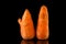 Strange carrots. Misshapen produce, food waste problem concept