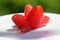Strange funny imperfect fresh juicy strawberries, unusual organic strawberries, trendy ugly food. Mutated strawberry