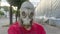 Strange man in a gas mask standing on the street in an empty city. Man wearing anti-pollution, anti-smog and viruses face mask