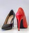 A strange pair of women`s red and black elegant high heels shoes