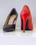 A strange pair of women`s red and black elegant high heels shoes