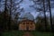 strange rusty abandoned observatory building in the forest