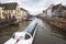 Strasberg water transport in winter, water canal in Petite France area. Half timbered houses and trees in Grand Ile. Alsace,