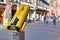 Strasbourg, France, February 2020: Yellow telescope binoculars in street in front of tourist attraction Cathedral of Strasbourg