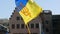 Strasbourg, France - March 26, 2022: Ukrainian flag with the coat of arms flutters in the wind