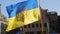 Strasbourg, France - March 26, 2022: Ukrainian flag with the coat of arms flutters in the wind