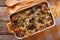 Strata casserole with spinach, cheese and bread close up. horizontal top view