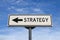 Strategy road sign, arrow on blue sky background