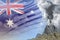 stratovolcano blast eruption at day time with white smoke on Australia flag background, problems of natural disaster and volcanic