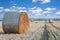 Straw bale / hay stack on sunny day with white clouds