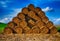 Straw bale heap on the cropped wheat field