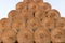 Straw bales on farmland. Bale of straw. Straw bales. Selective focus Straw bales stacked on the pile