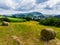 Straw bales on the field near Saschiz fortified church in Saschiz villages, Sibiu, Transylvania, Romania. Agriculture landscape, g