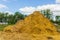 Straw bales on a sloping field On a sunny day.