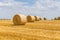 Straw bales stacked in a field at summertime, Reims , France