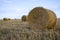 straw bales. Wheat straw. The bales are ready to be loaded in the field. New harvest. Yellow straw.