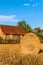 Straw ball on field in the Czech Republic. Harvested field. Morning on the far. Hay bales after harvest on the field. hay-roll on