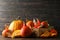 Straw basket, pumpkins, leaves and cinnamon on wooden background