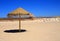 Straw beach sunshade, Deserted beach, Near Lisbon, Portugal.