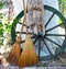 Straw broom with wooden wheel