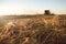 Straw and combine harvester on a harvested wheat field