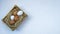 Straw and eggs in wooden crates on plaster concrete floor with copy space