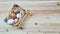 Straw and eggs in wooden crates on wooden background with copy space