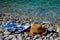 Straw hat, sunglasses, flip flops, towel on a background seascape