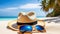 Straw hat and sunglasses on the sand near the sea