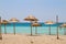 Straw parasols on a beach