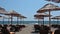 Straw parasols on the sandy beach of Ulcinj