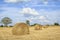 Straw rolls on harvested field, central France