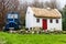 Straw roofed cottage and tractor