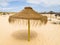 Straw sunshade on a beach in Portugal.